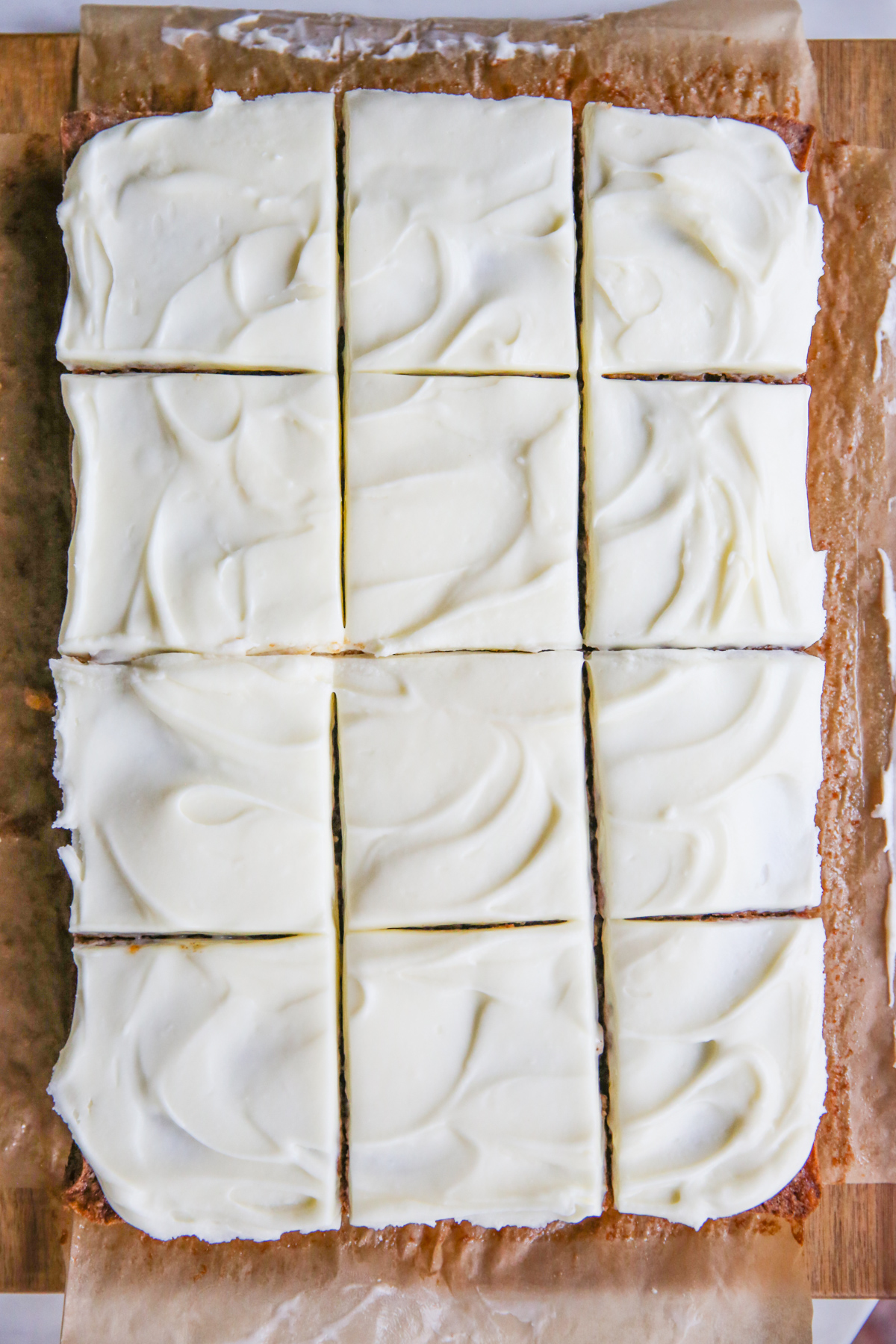 sliced carrot cake in a 9x13 pan