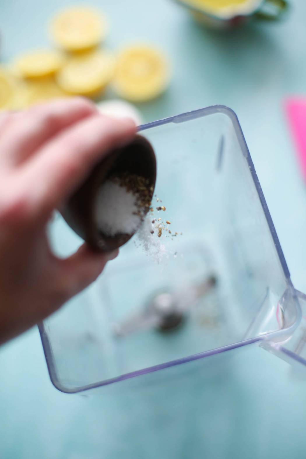 adding ingredients to Garlic-Herb Lemon Vinaigrette and Marinade from Our Best Bites