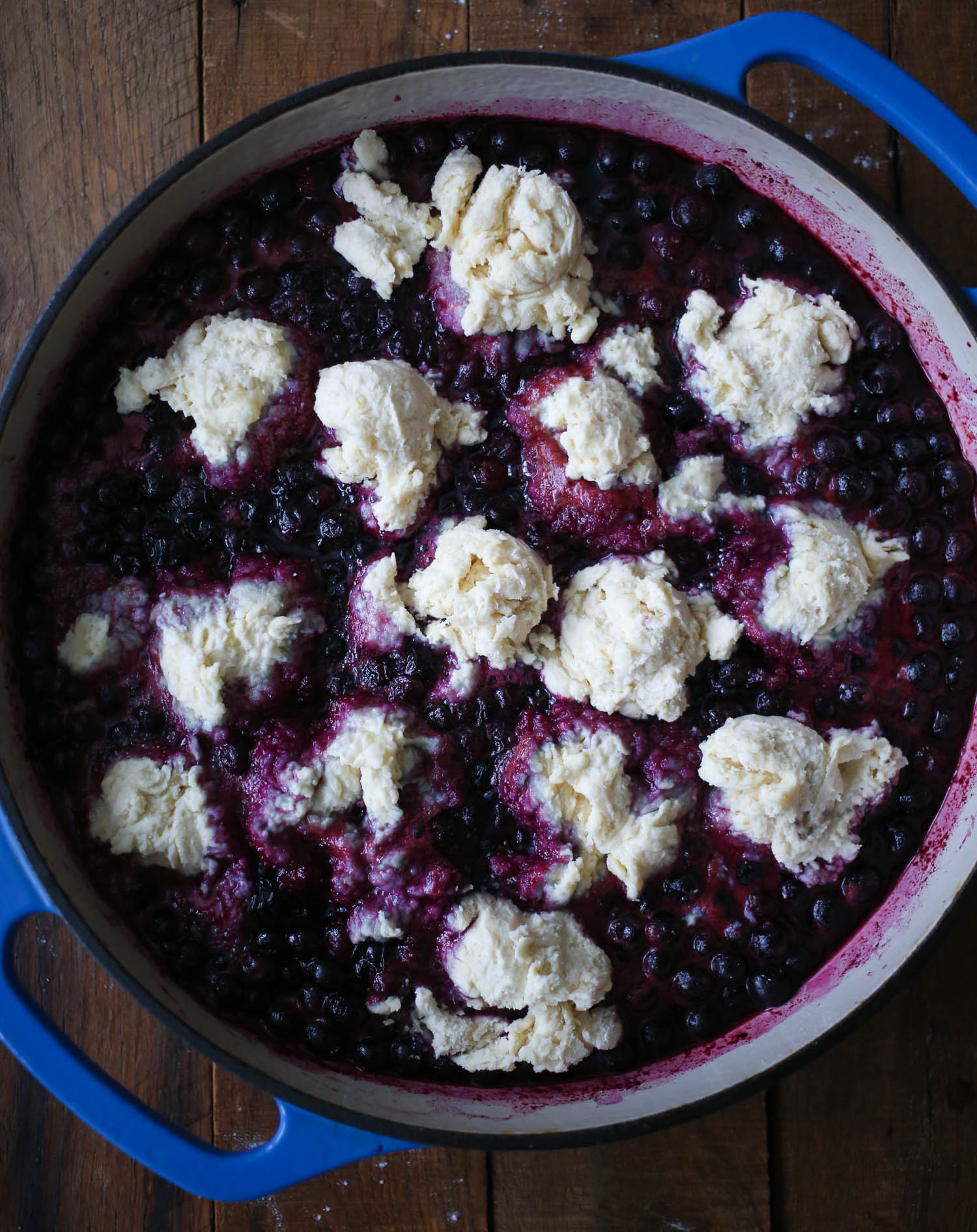adding biscuit dough to Blueberry Grunt from Our Best Bites