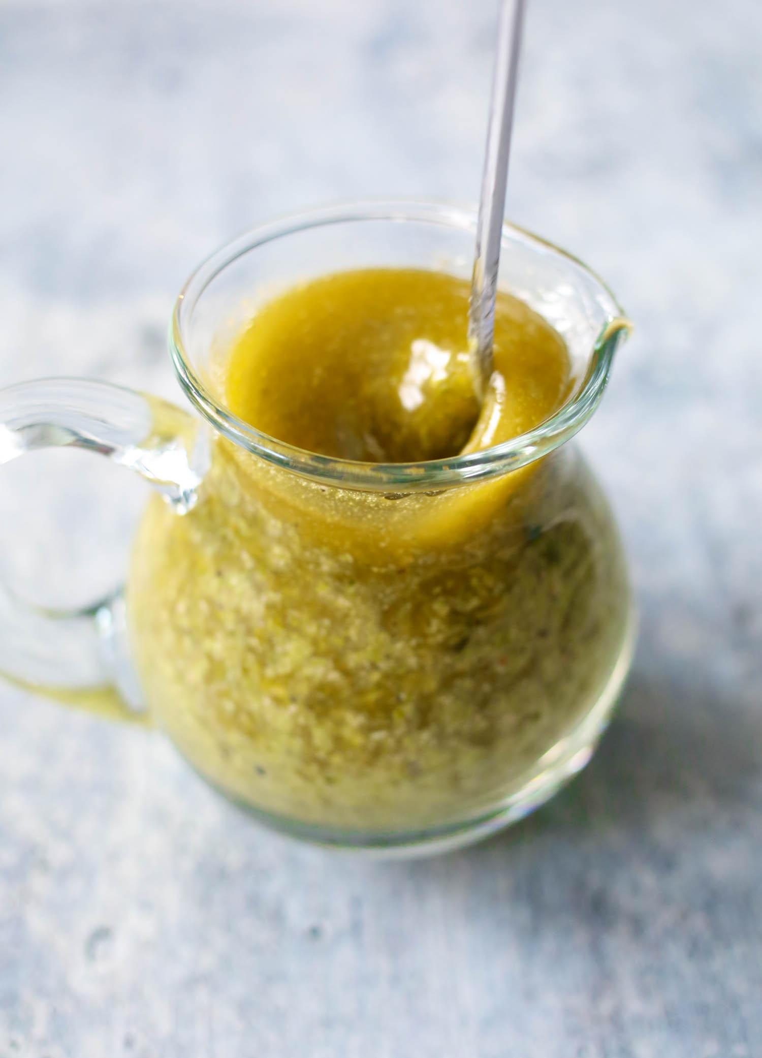 whisking together pesto and Italian dressing