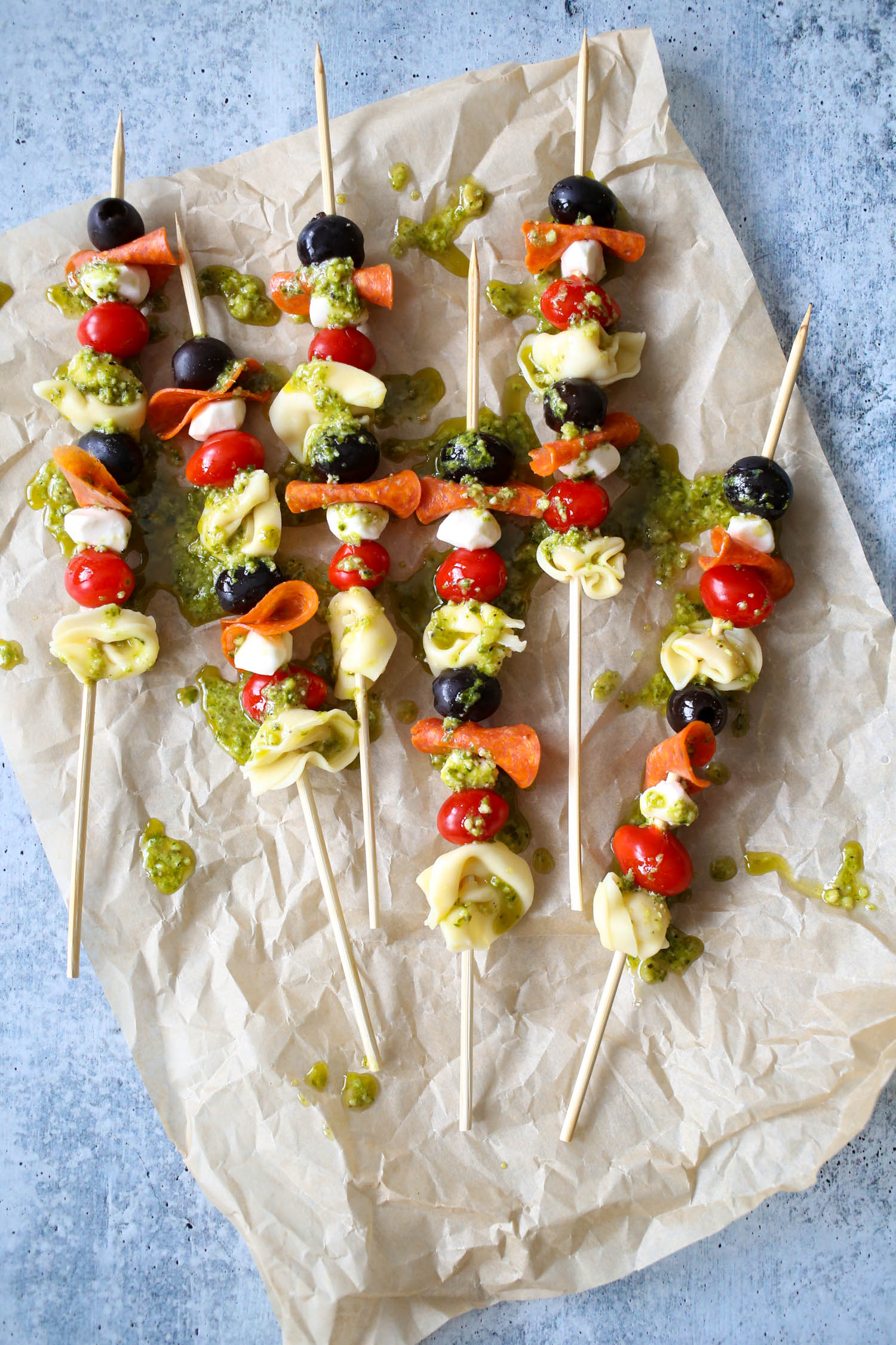Italian Tortellini Skewers with Pesto Drizzle from Our Best Bites