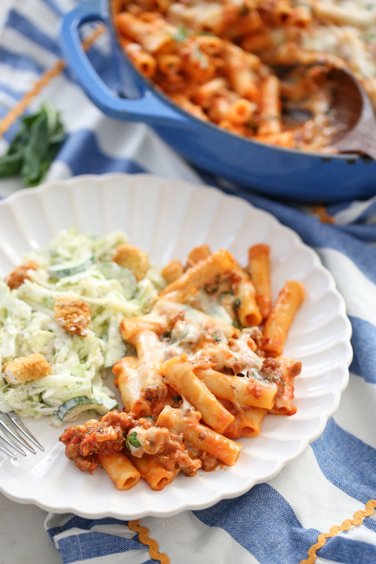 Skillet Baked Ziti from Our Best Bites served on a plate with salad