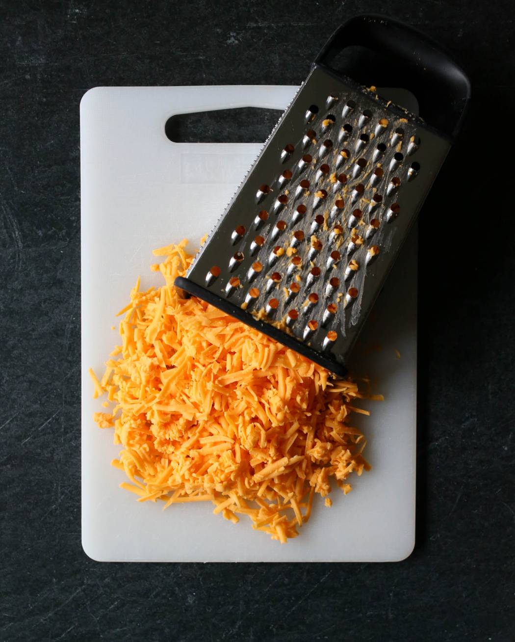 grated cheese for cheeseburger macaroni from our best bites