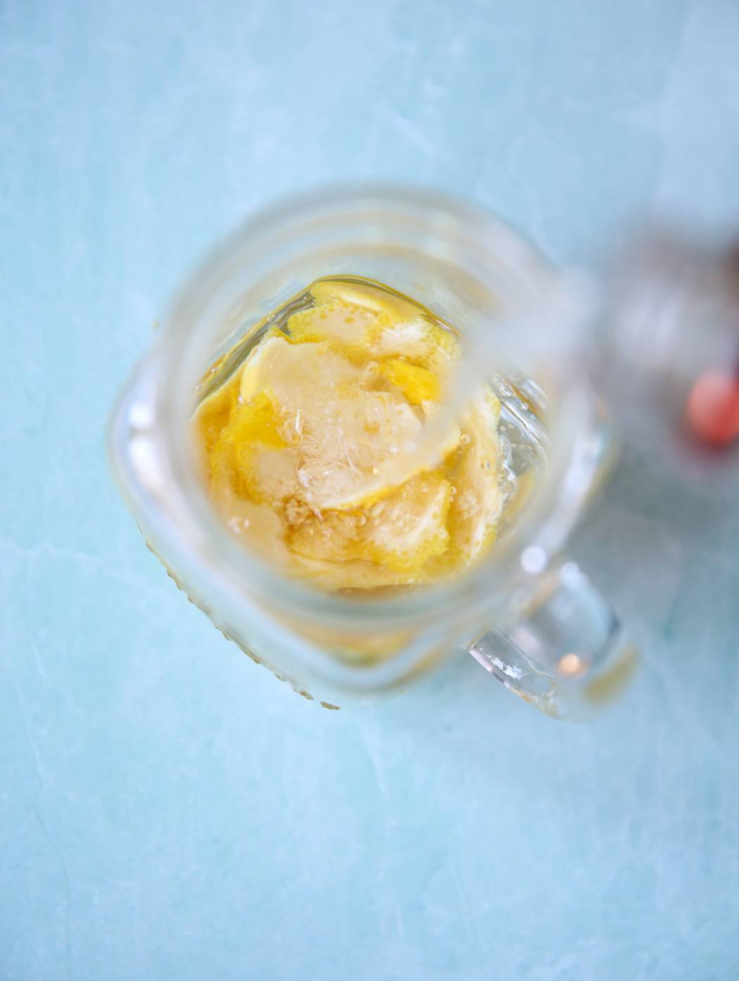 pouring vodka over lemons