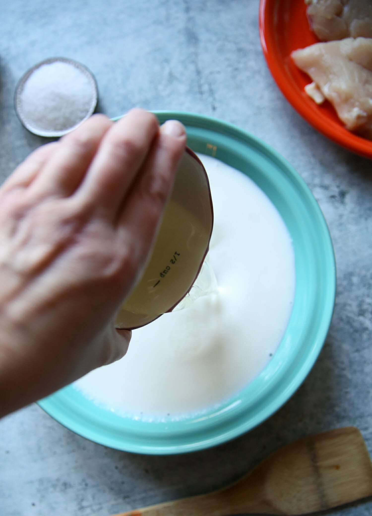 adding pickle juice to air fryer chicken breast from our best bites
