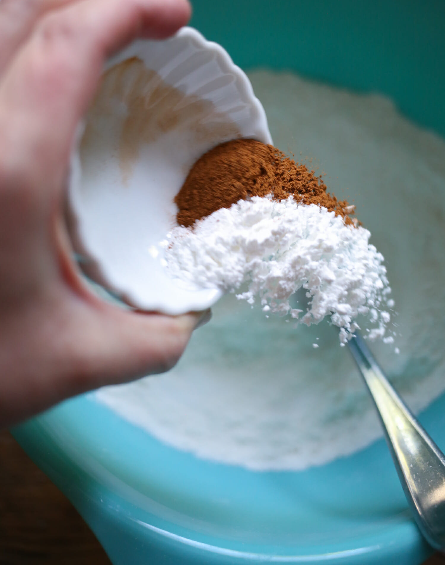 adding salt, cinnamon, and baking powder for skillet blackberry cobbler