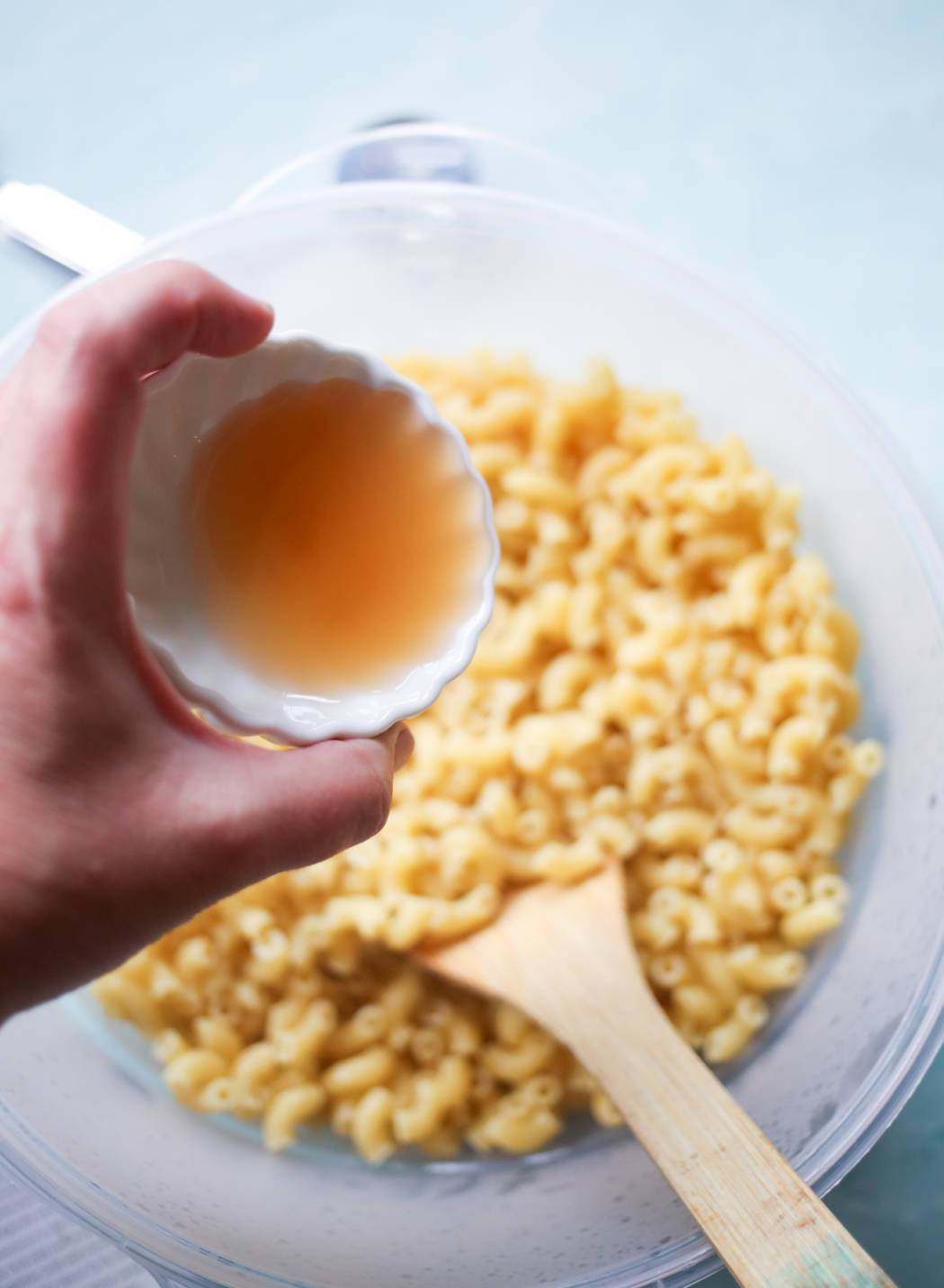 adding apple cider vinegar to macaroni salad