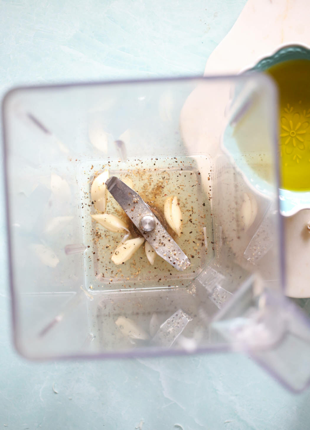 vinegar, lemon juice, garlic, salt, and pepper in blender jar for sensation dressing