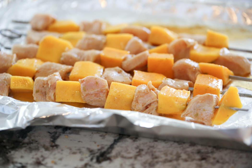 Chili-Lime Mango Chicken Skewers ready to cook. 
