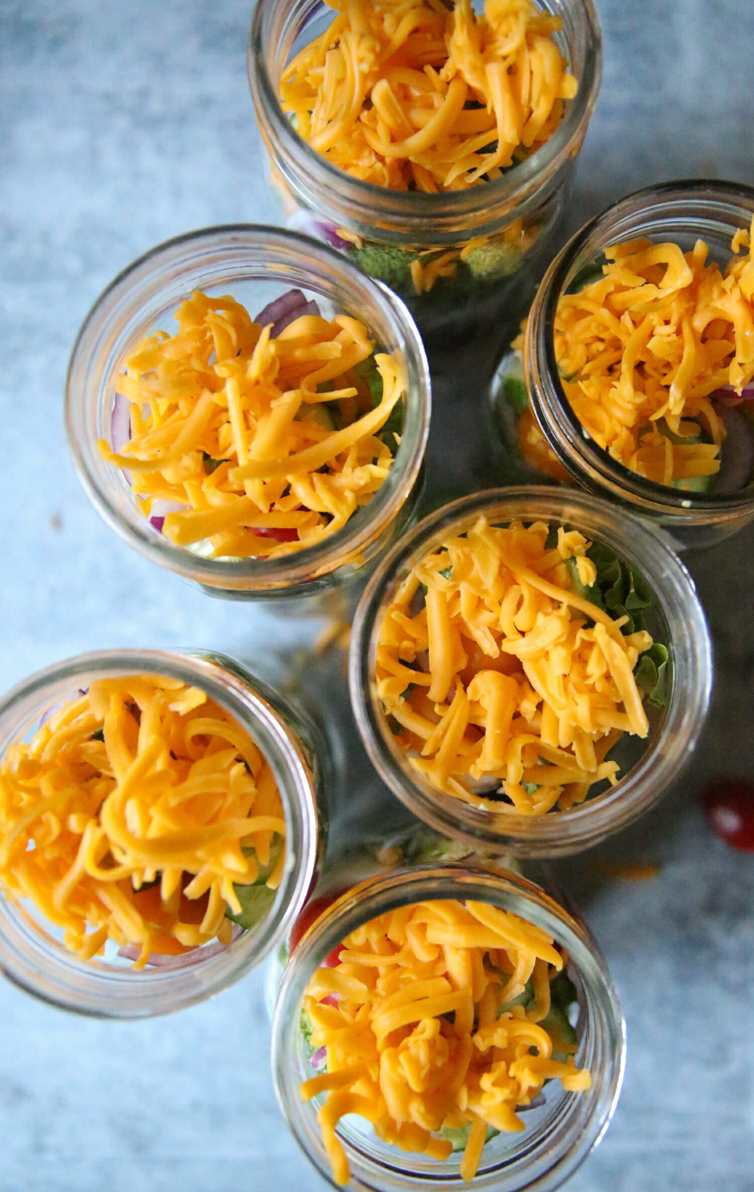 cheese on top of salad jars