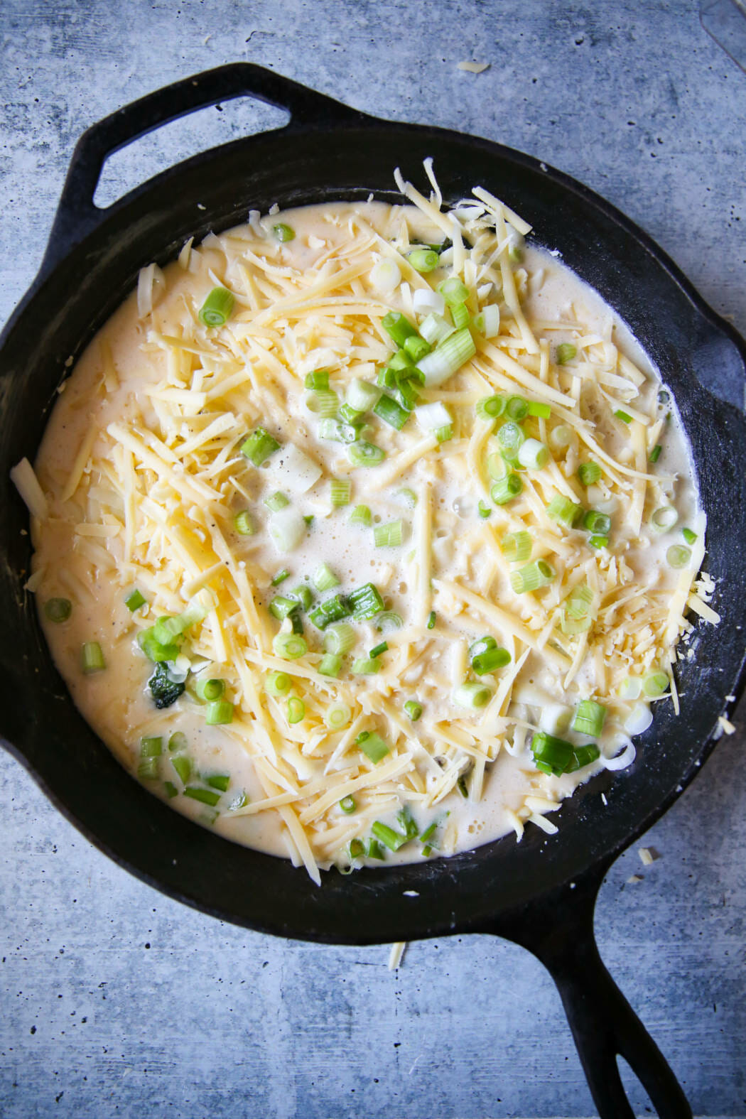 egg mixture over bacon and spinach