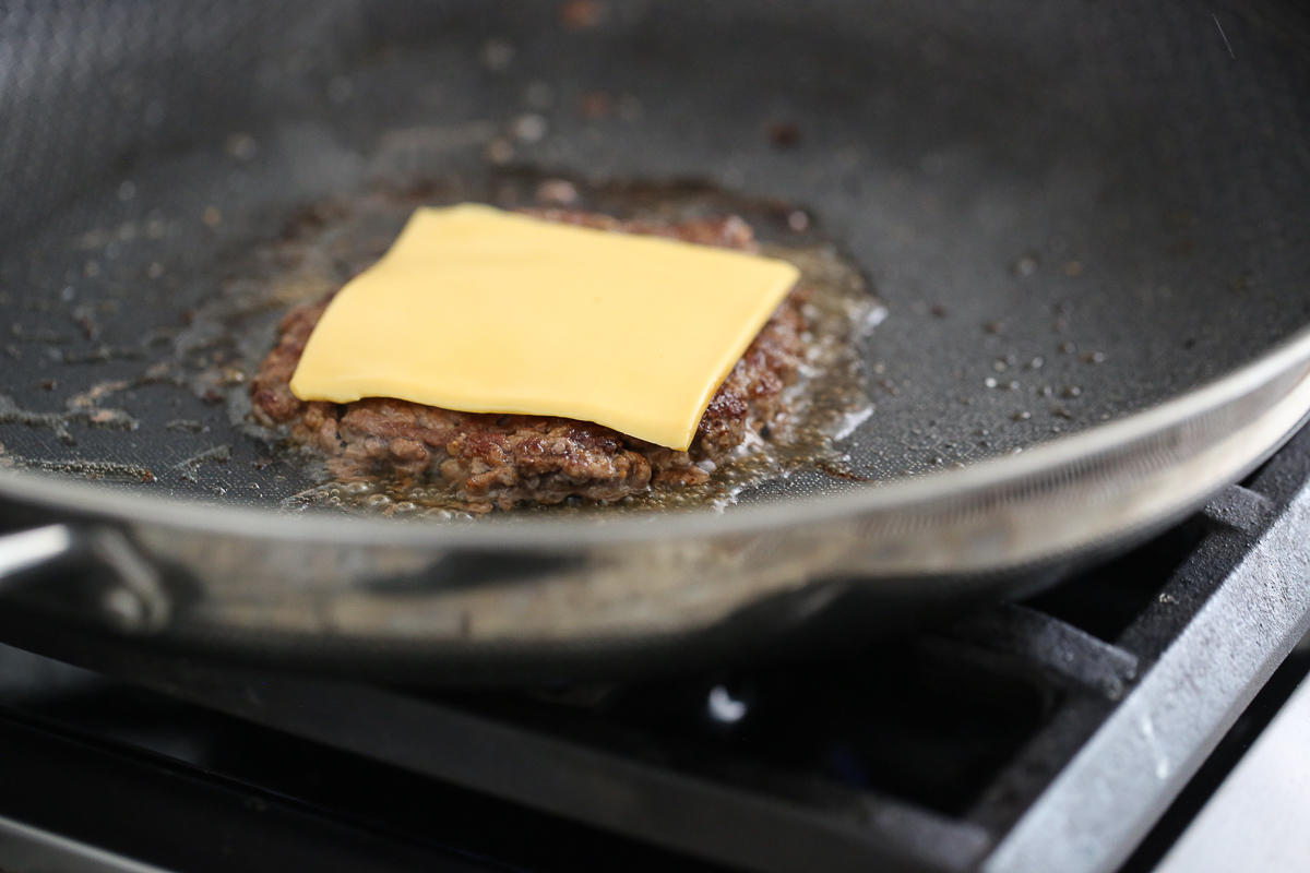 hamburger in a pan with cheese