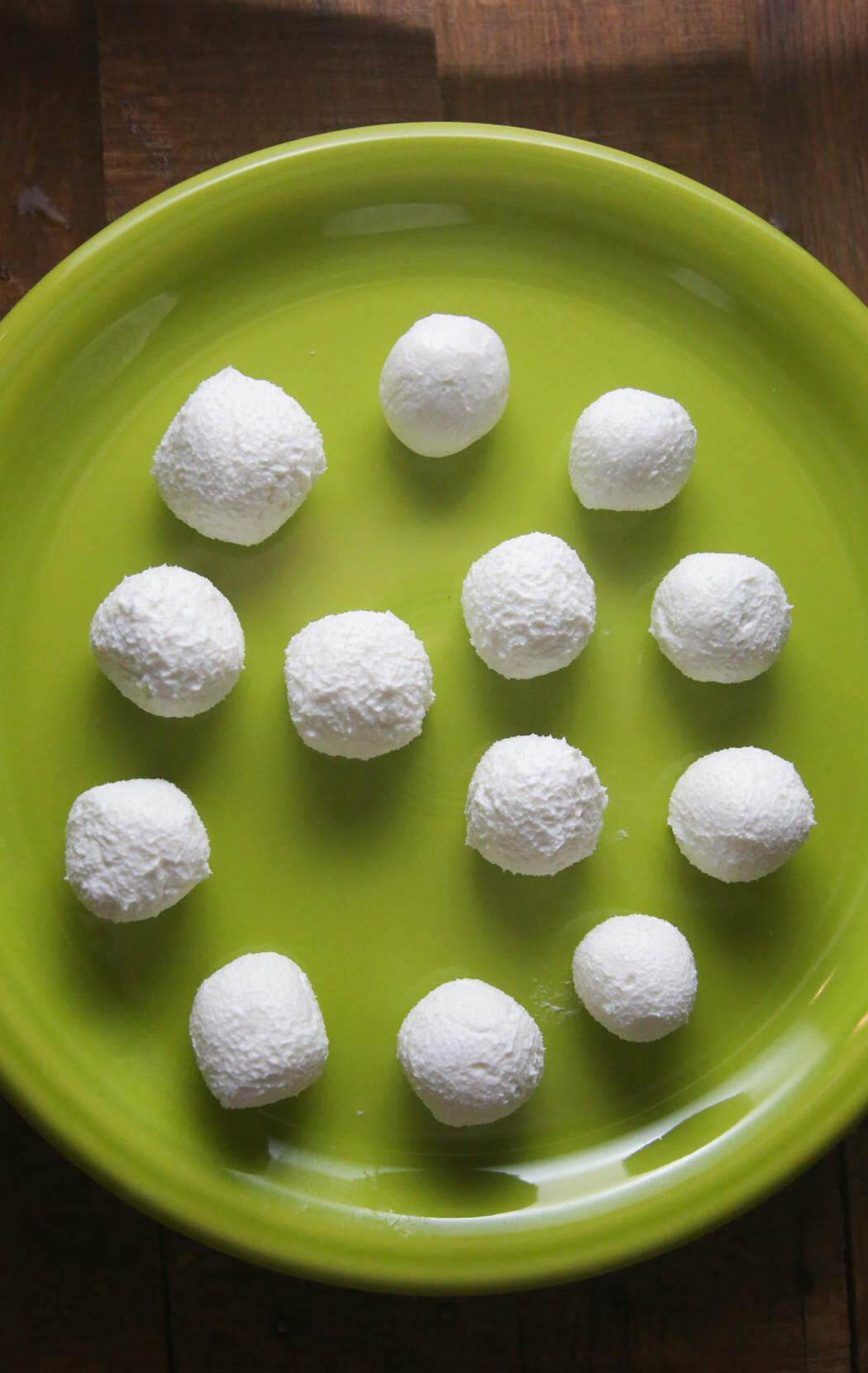 goat cheese balls on a green plate