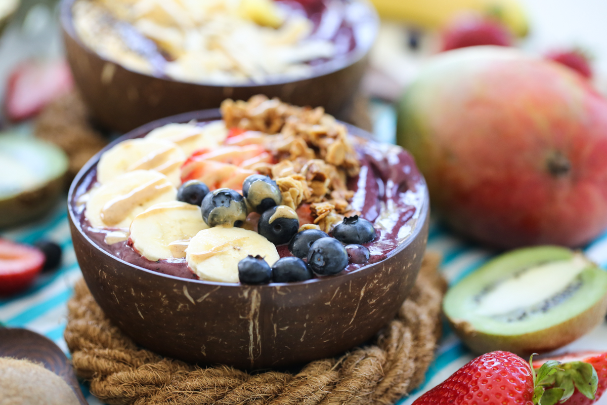 acai bowls topped with tropical fruit