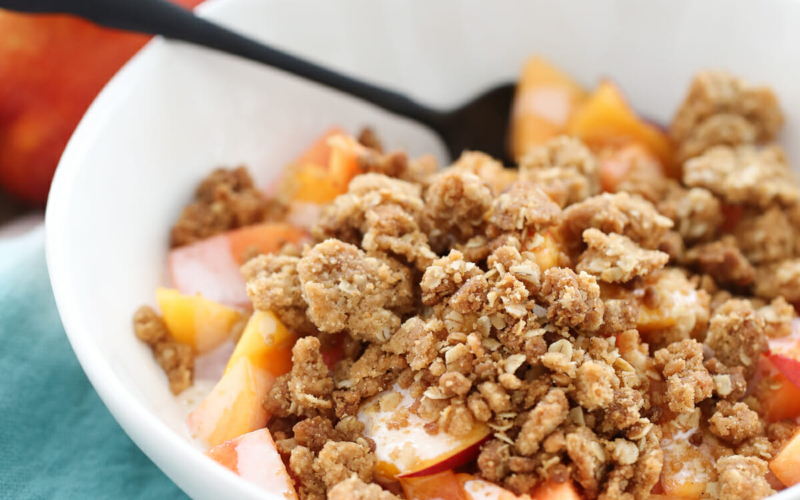 crumble topping over peaches and cream