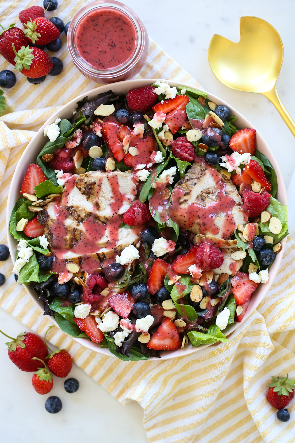 grilled chicken and berry salad on a plate