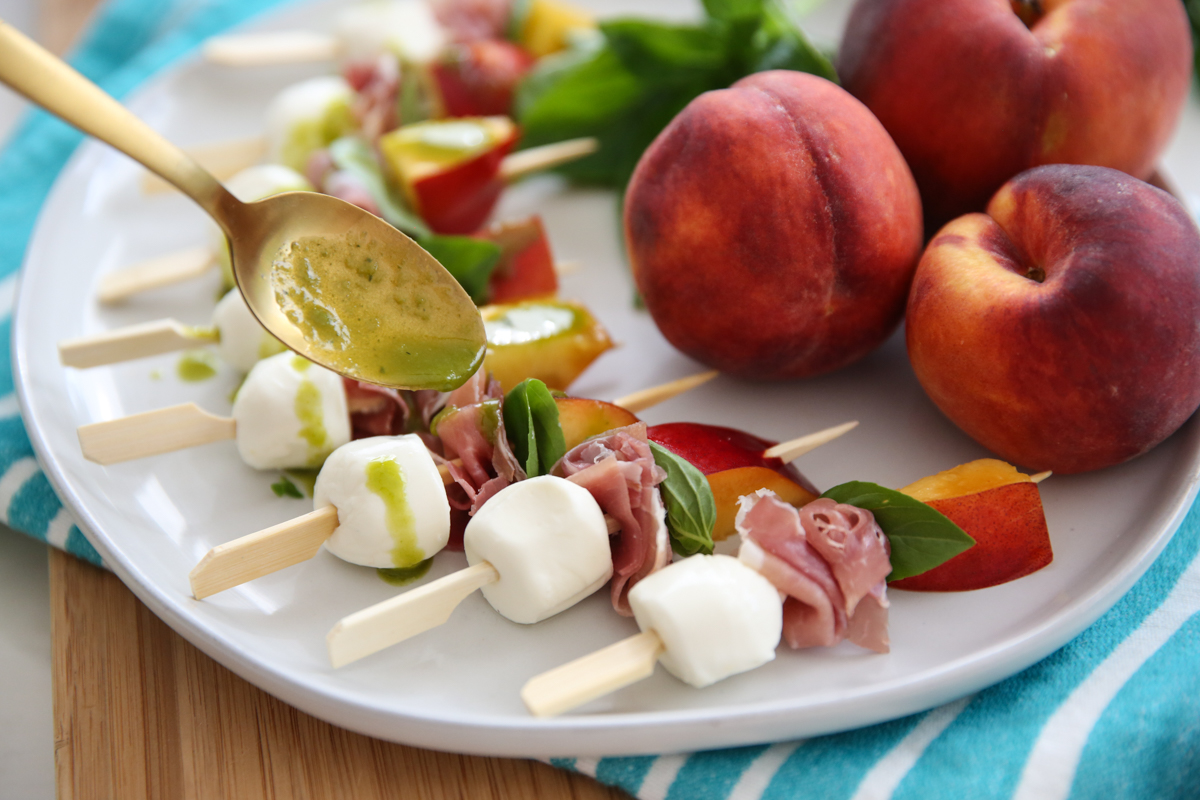 peach mozzarella skewers on a plate