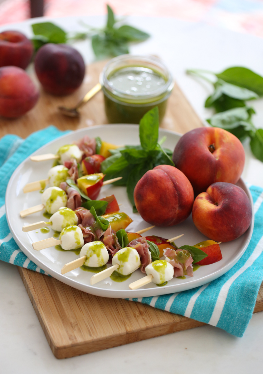 peach mozzarella skewers on a plate