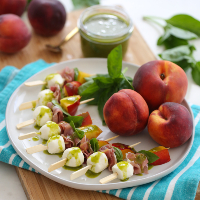 peach mozzarella skewers on a plate