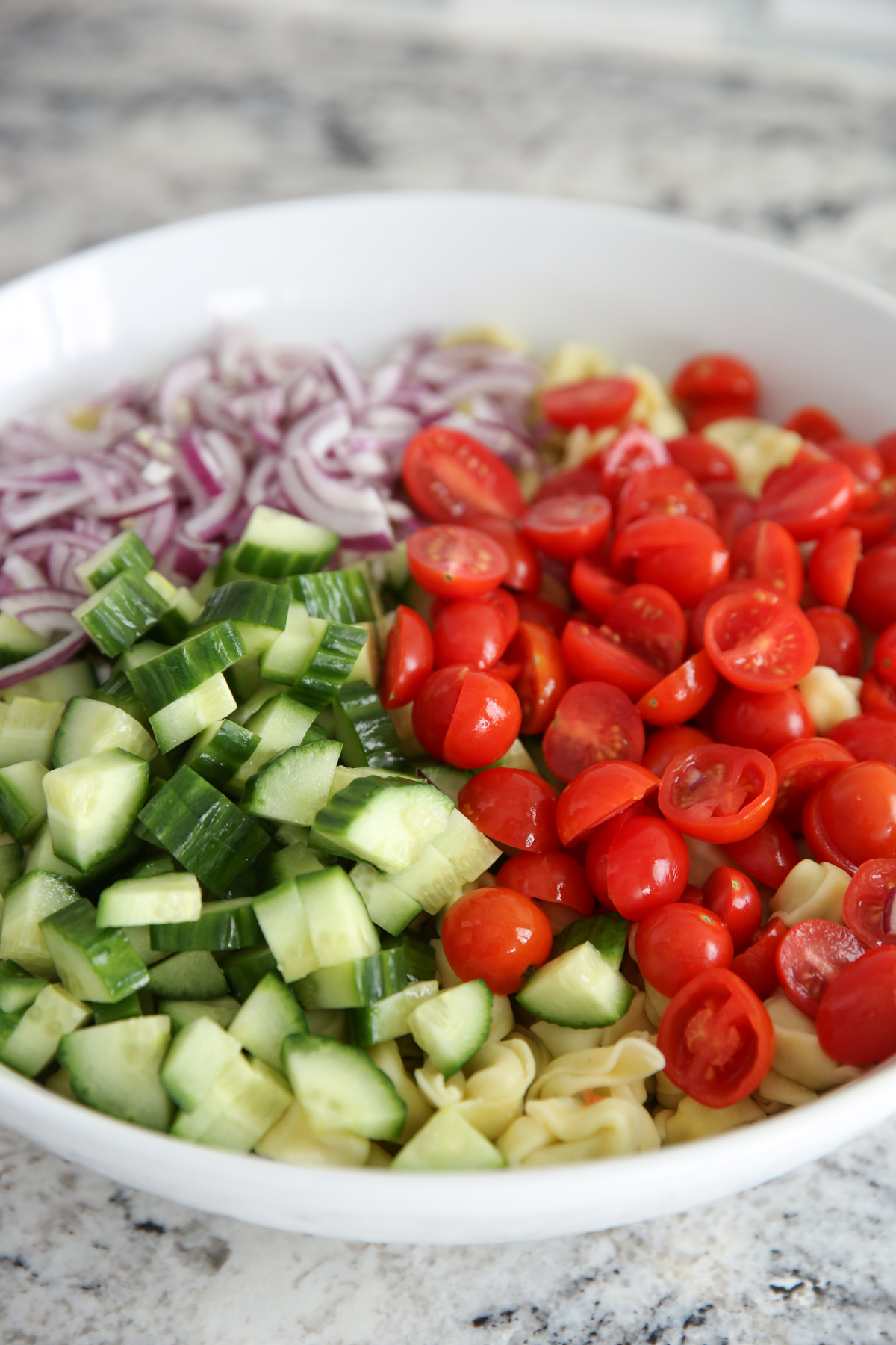 Tortellini Pasta Salad in a white serving bowl