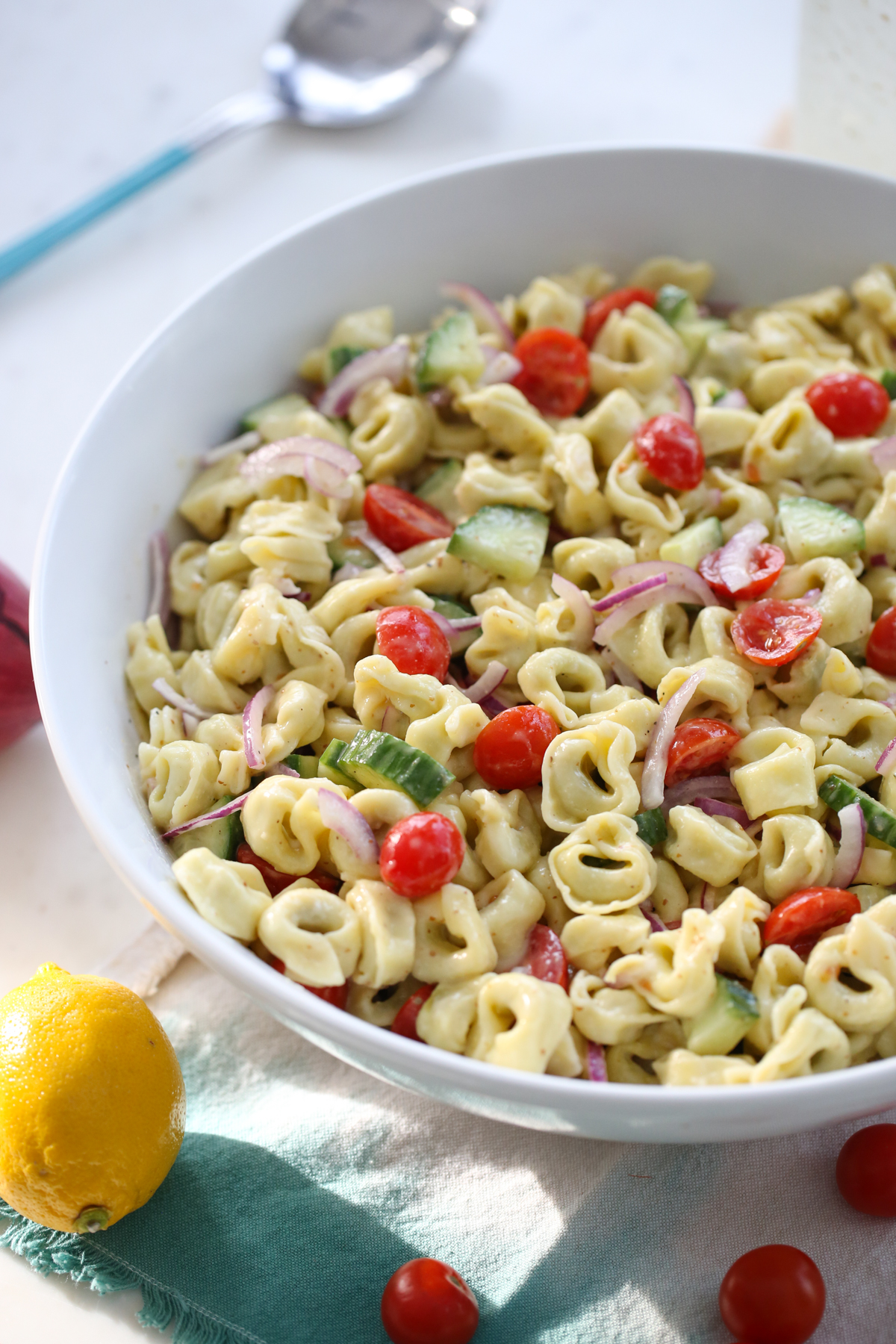 Tortellini Pasta Salad in a white serving bowl