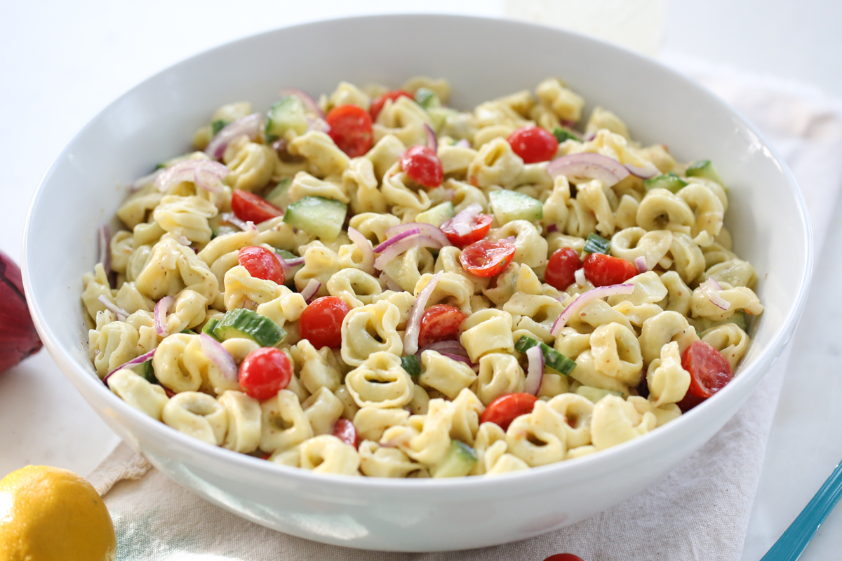 Tortellini Pasta Salad in a white serving bowl