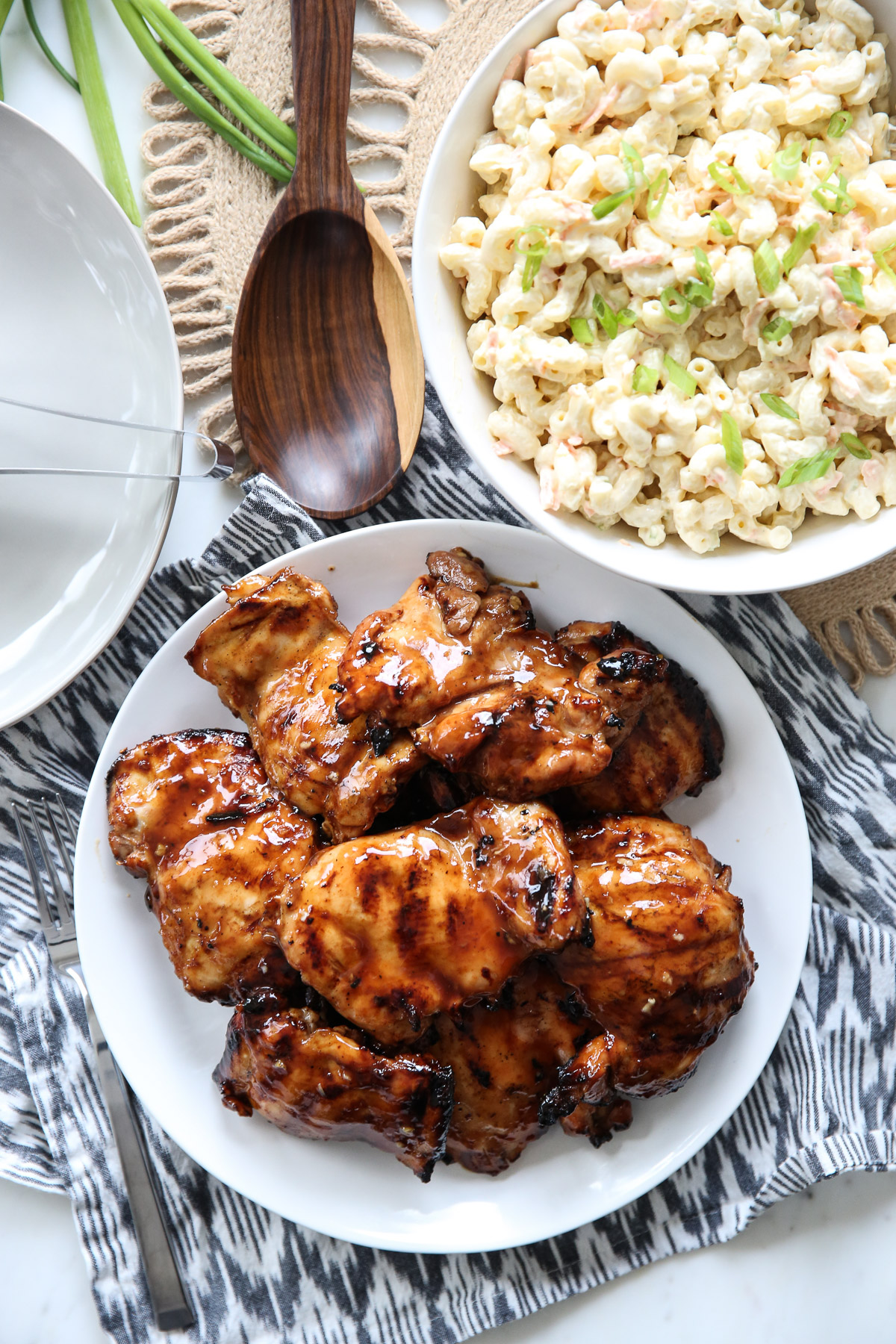 Huli Huli Chicken thighs on a white plate.