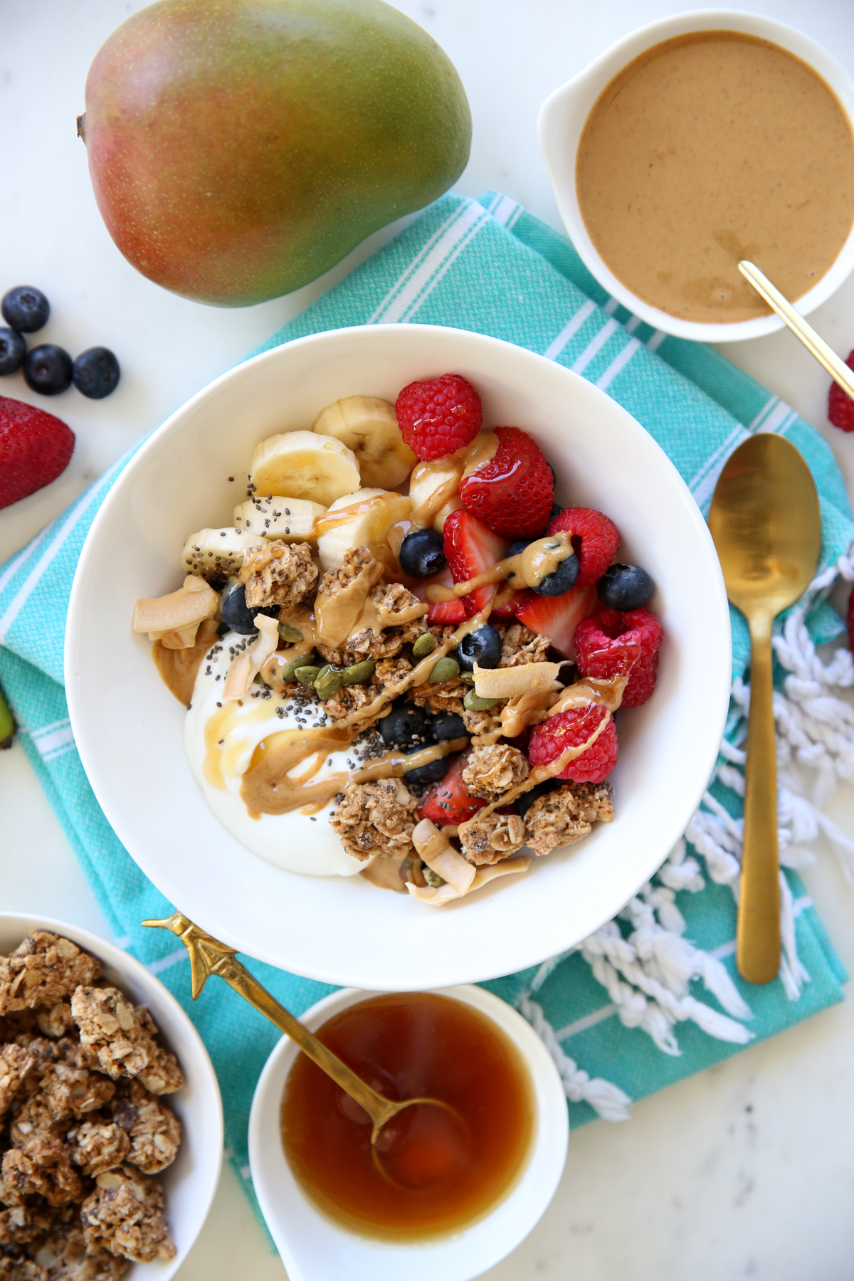 yogurt parfait ingredients in a white bowl