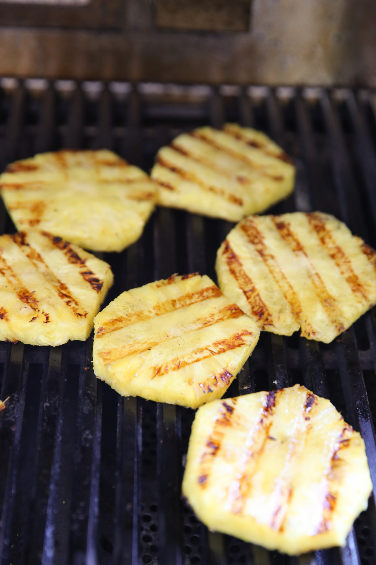 sliced pineapple on a grill