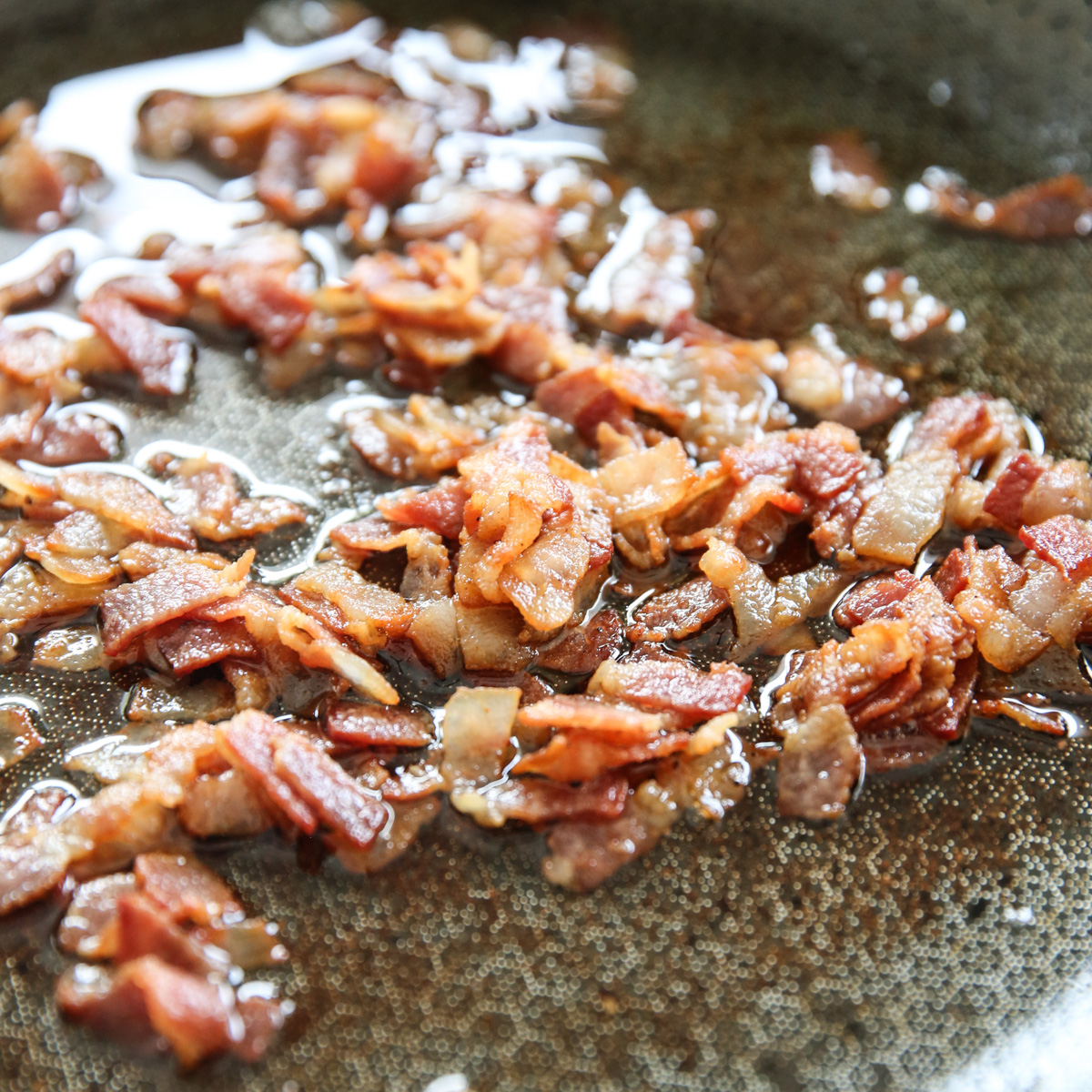 cooking bacon in a skillet