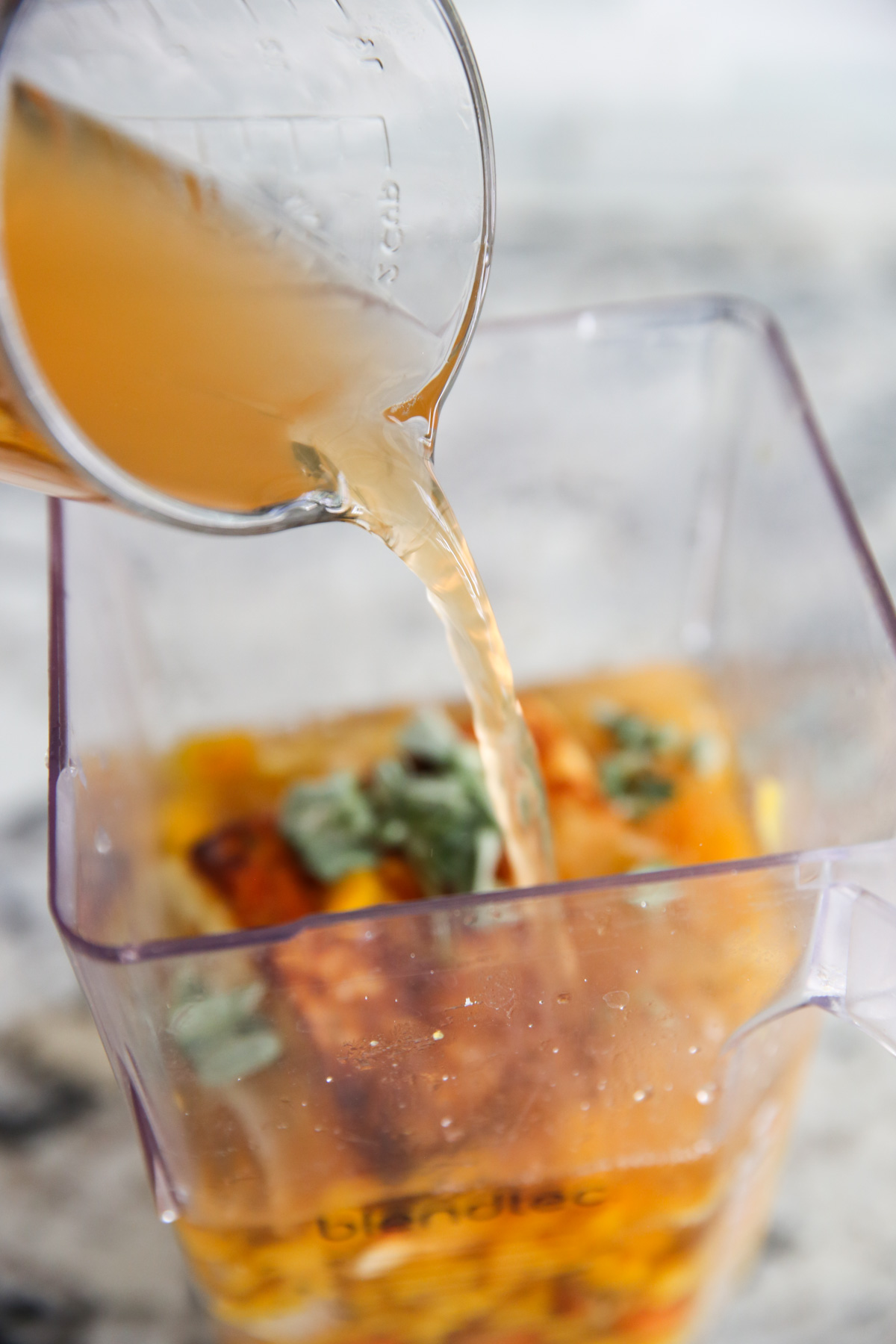 pouring broth into blender