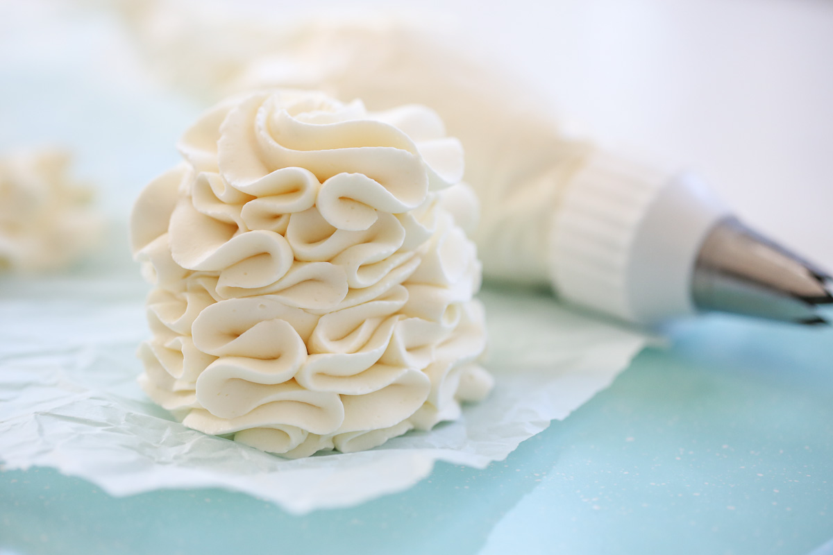 Pile of whipped frosting on a piece of parchment