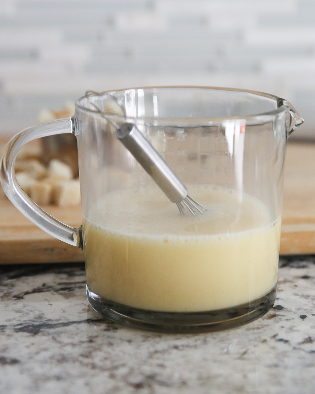 chicken broth and egg in a mixing glass