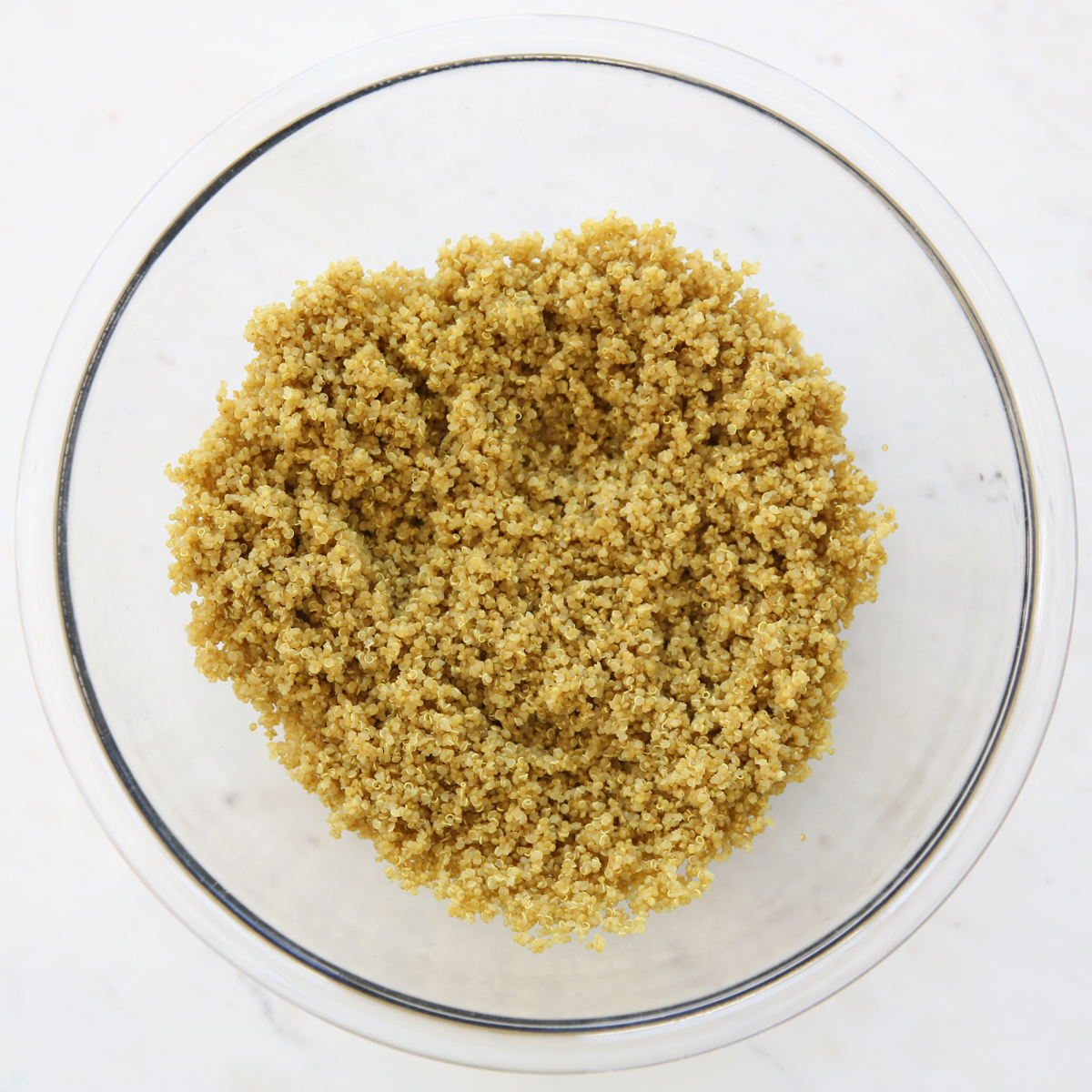 Cooked quinoa in a glass bowl
