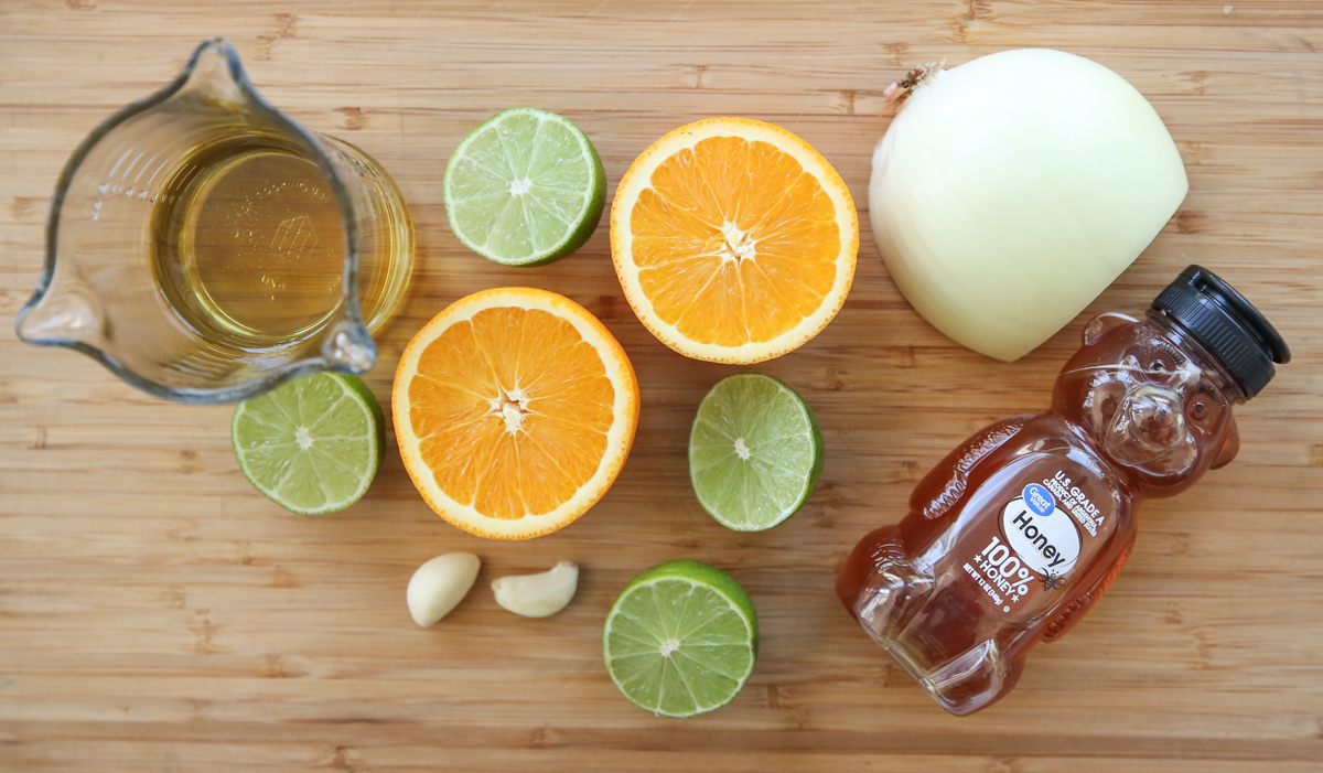 Honey Citrus Vinaigrette dressing ingredients on a cutting board