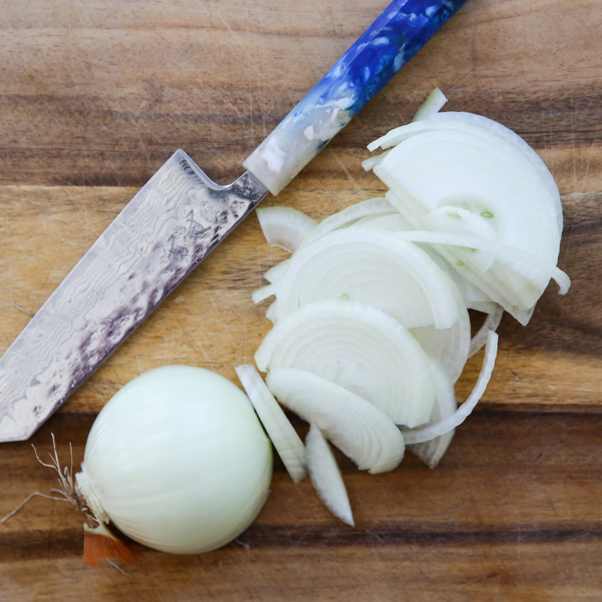 sliced onions on a cutting board