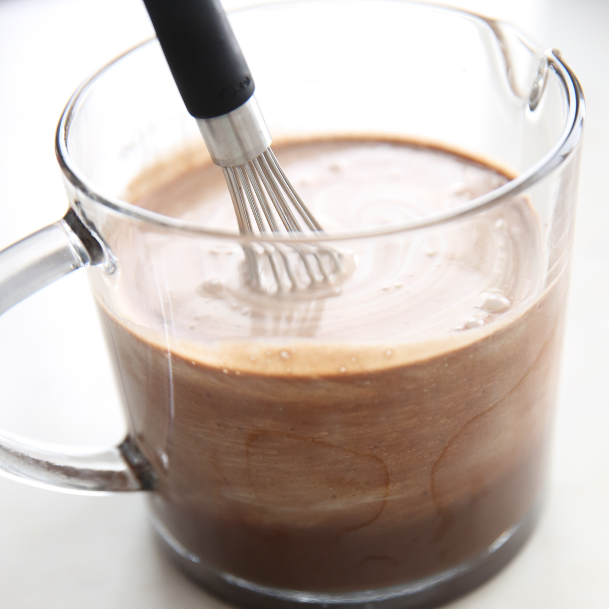 whisking chocolate ice cream base