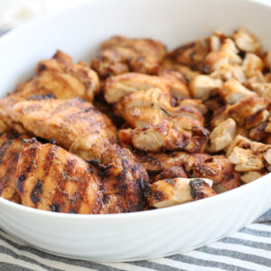 grilled chicken thighs in a serving bowl
