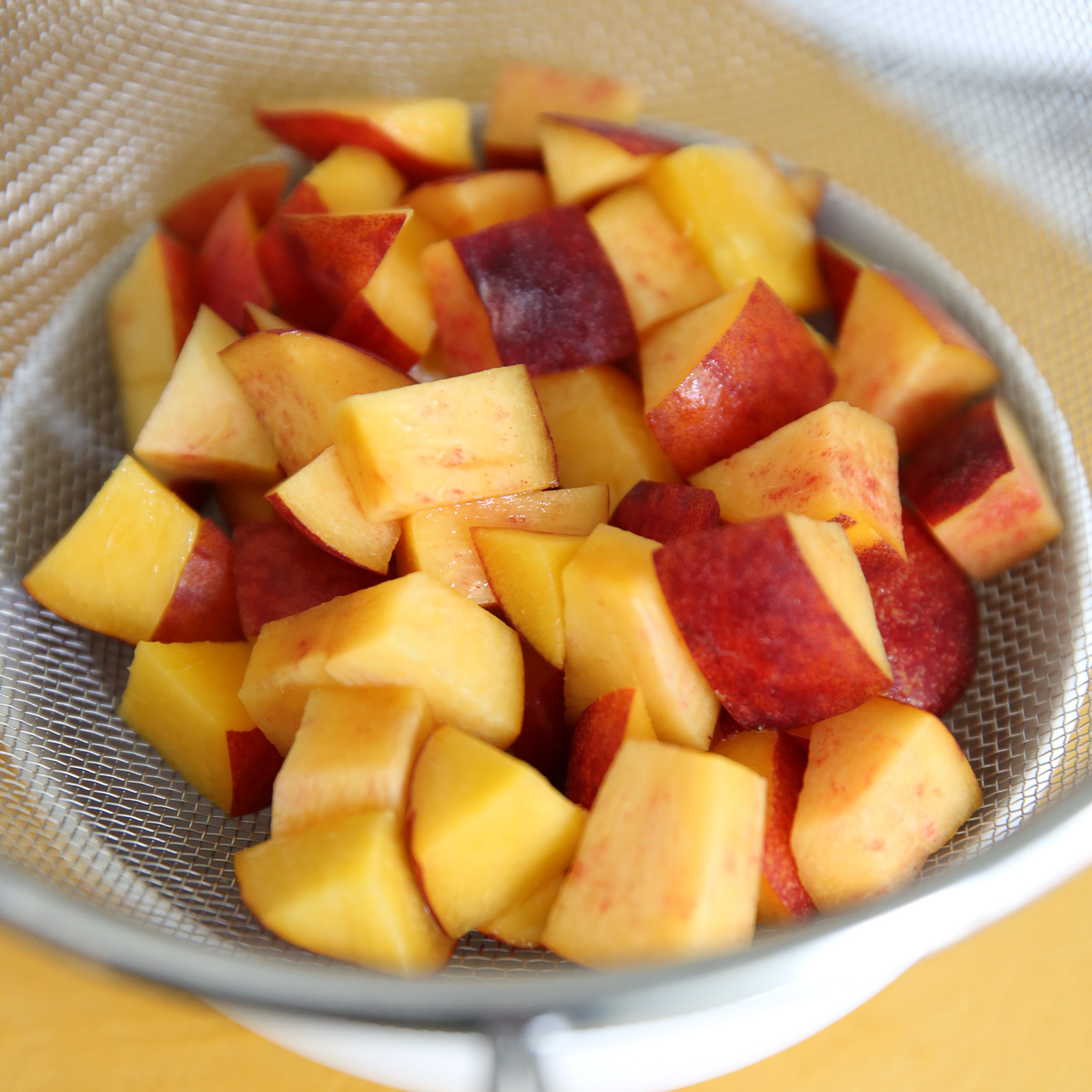 sliced fresh peaches in a bowl
