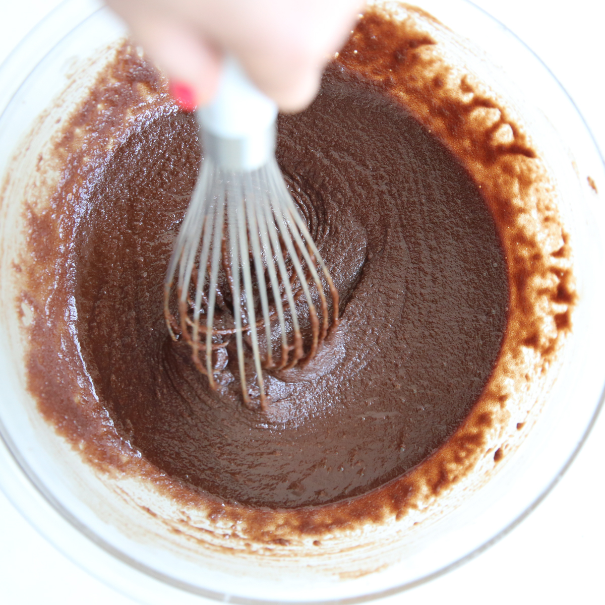 whisking brownie batter