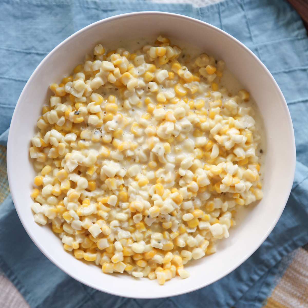 pot of boursin creamed corn in a white bowl