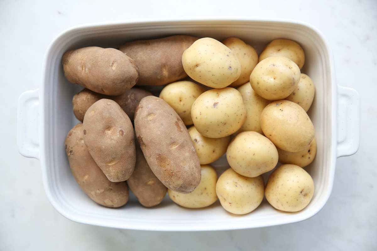 russet and yukon gold potatoes in a baking dish
