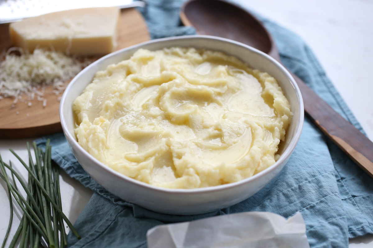 creamy mashed potatoes in a white bowl