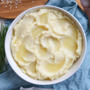 creamy mashed potatoes in a white bowl