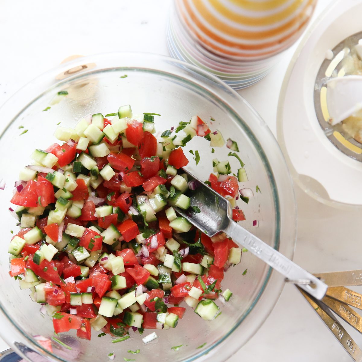 tomato, cucumber and onion in a bowl