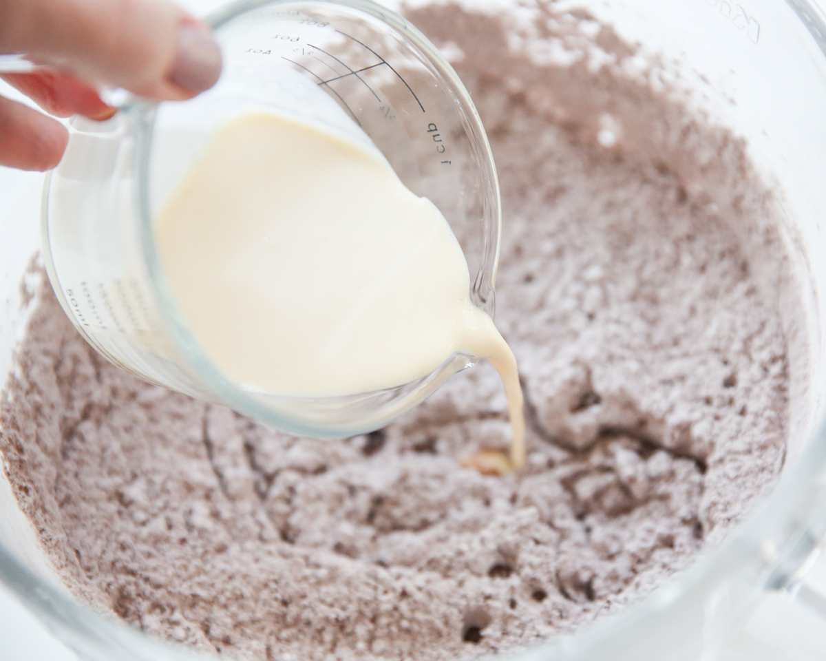 making chocolate frosting in a mixing bowl