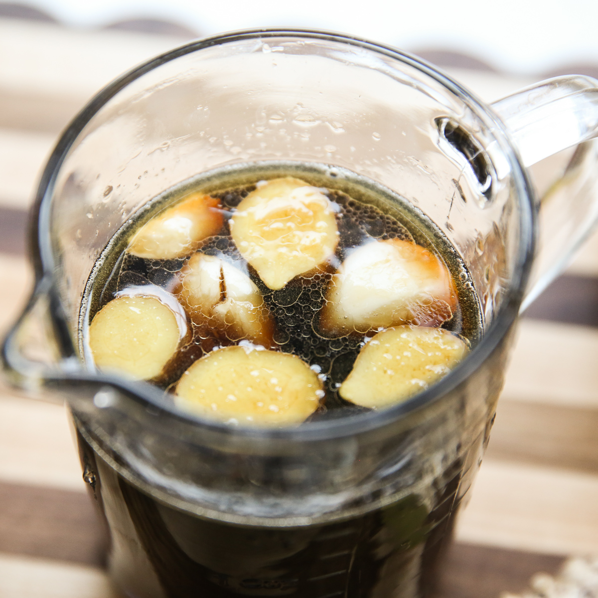 glass measuring cup containing egg marinade