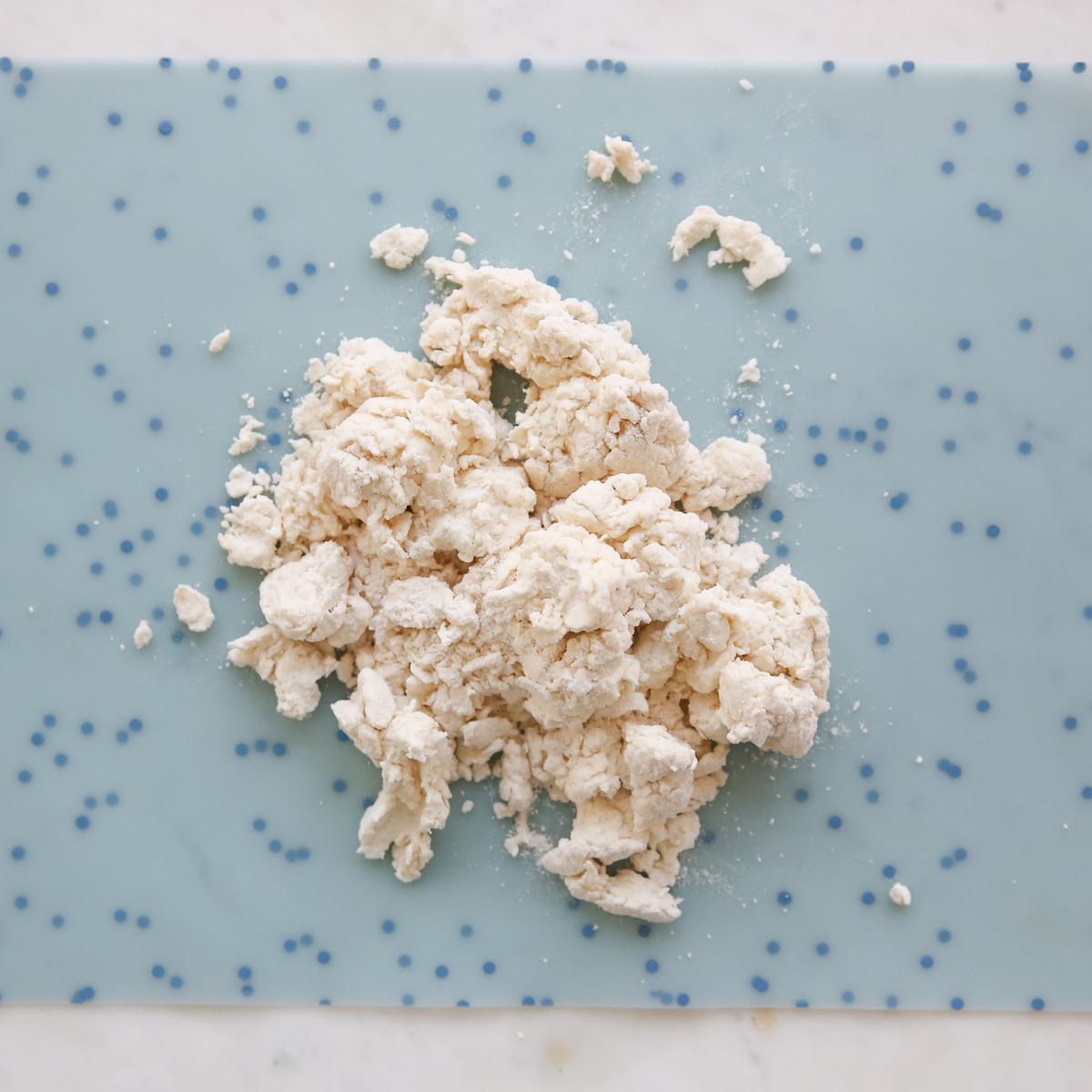 flatbread dough on a silicone mat