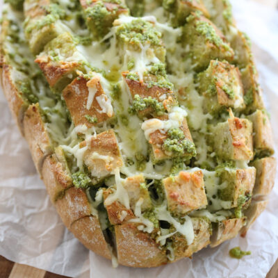 close up of garlic pesto bread with cheese