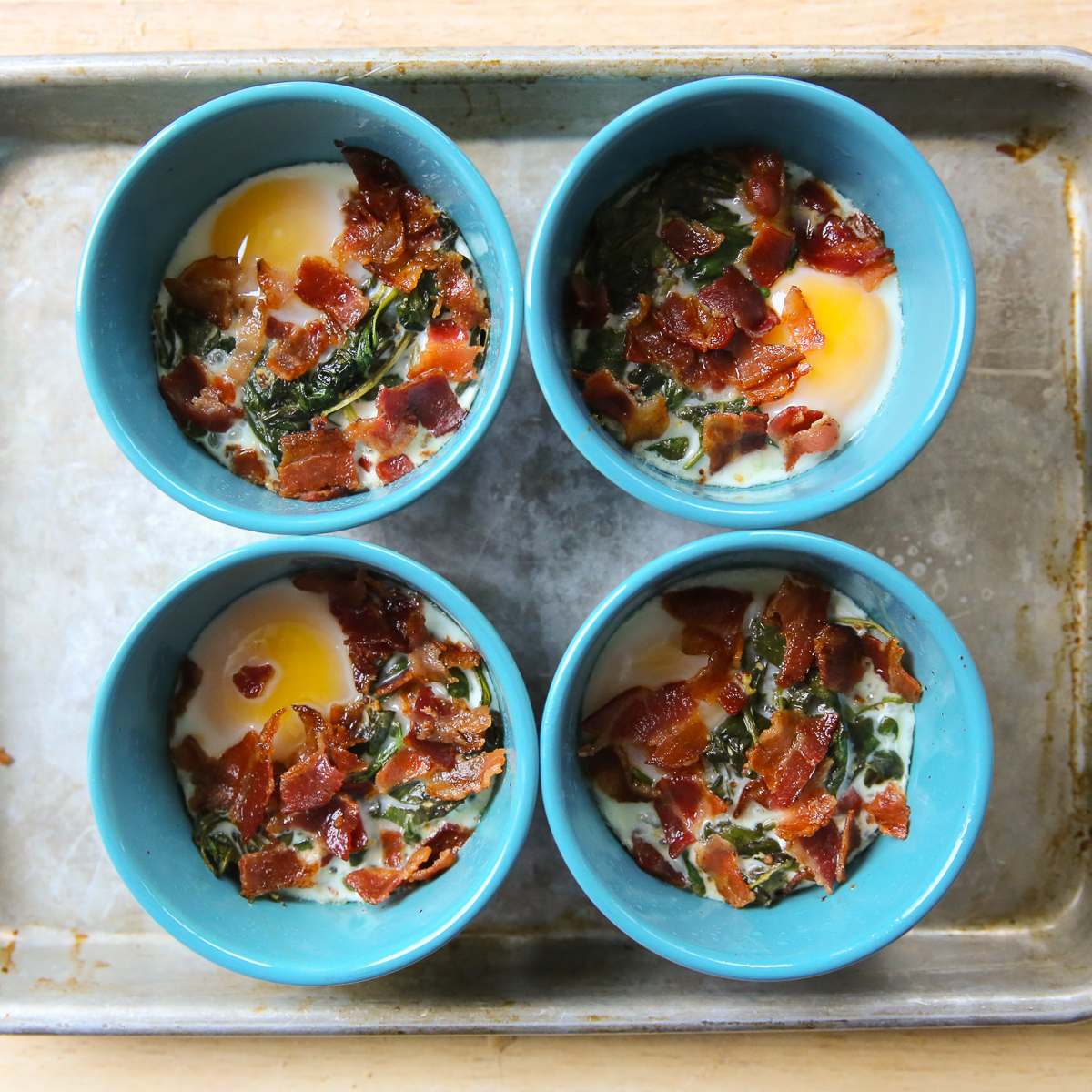 baked eggs with bacon in ramekins